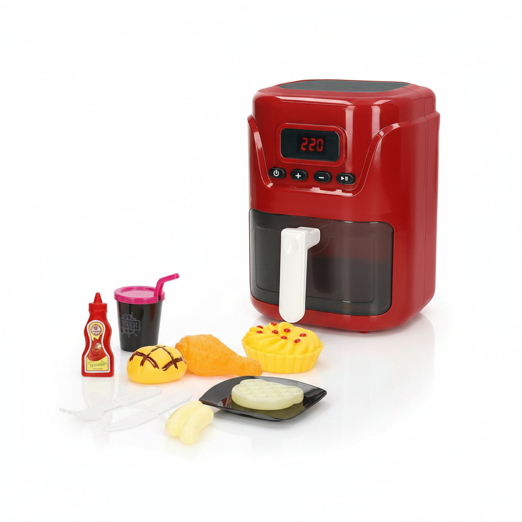 Crveni dečiji air fryer sa digitalnim displejem, plastičnim priborom, kečapom, čašom i igračkama hrane na beloj pozadini.